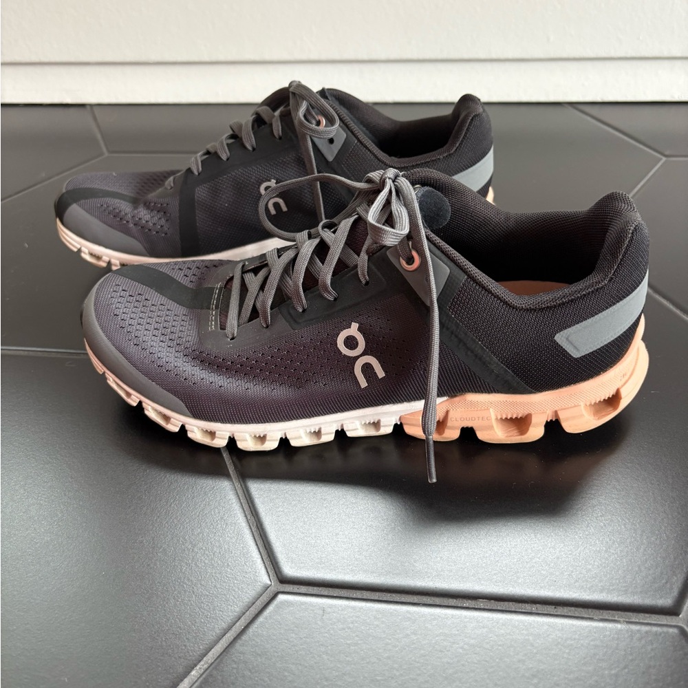 On Running Black and Gray and Peach soled Athletic Shoes